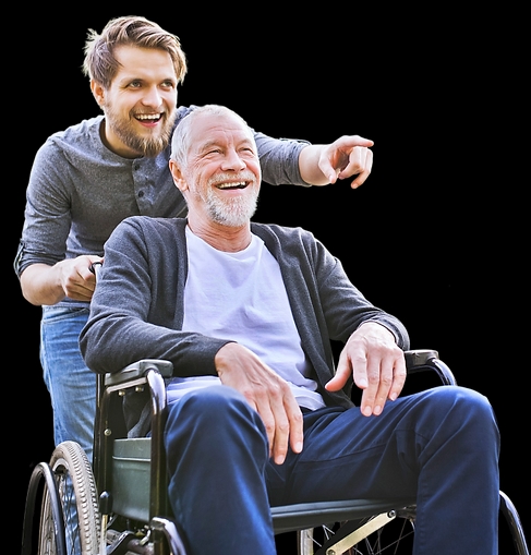 Two happy persons, one in a wheelchair