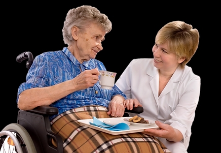Two happy persons, one in a wheelchair